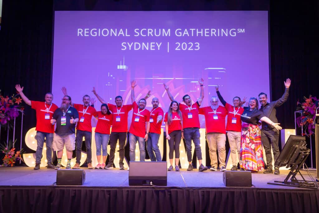 Volunteers waving at Scrum Australia 2023